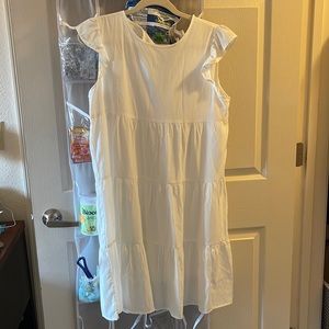 White dress with key hole on back, brand new never worn, with ruffle sleeve